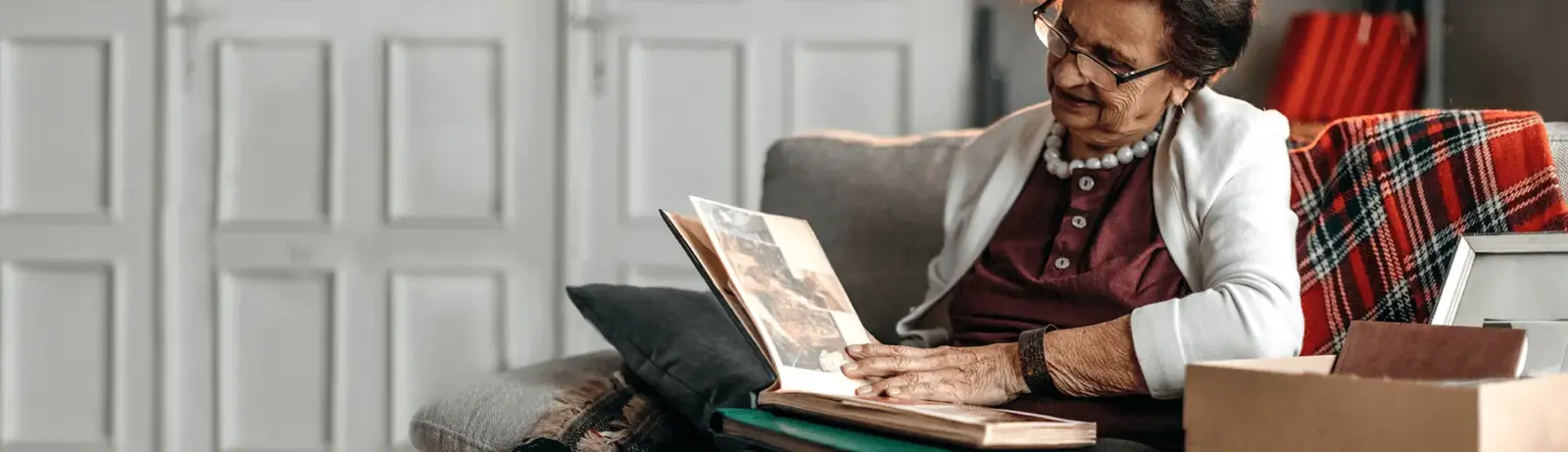 A caregiver providing memory care support to a senior living at home